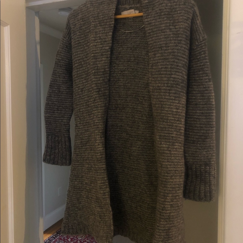 Wool blend. Slightly shrunken.